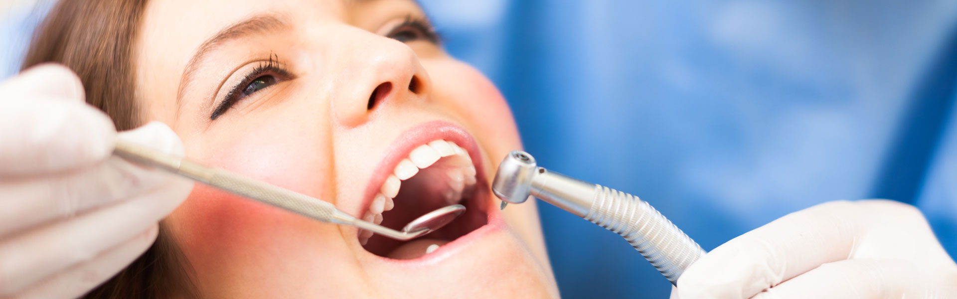 Dentist examining patient teeth