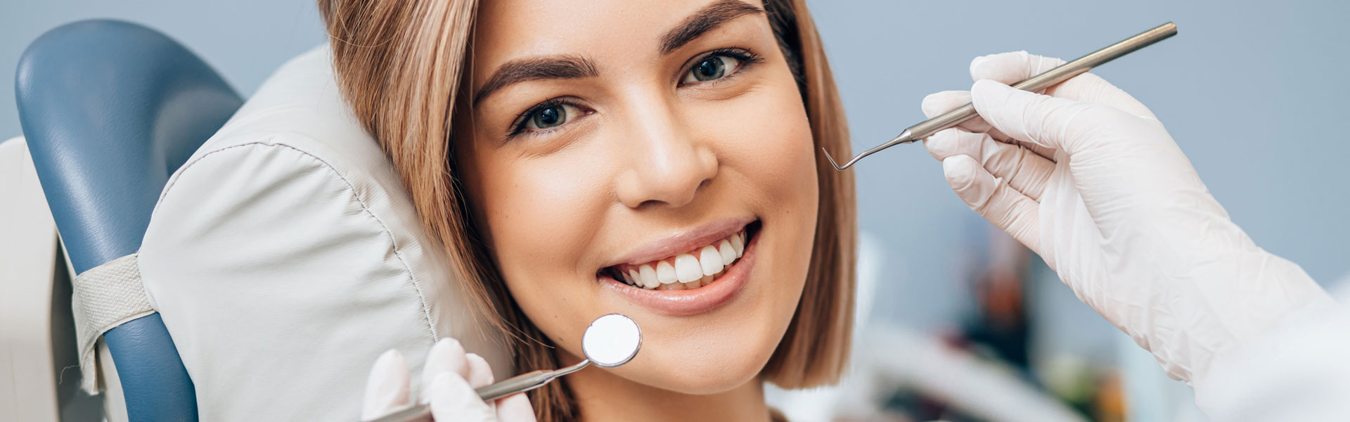 Dentist examining patient teeth