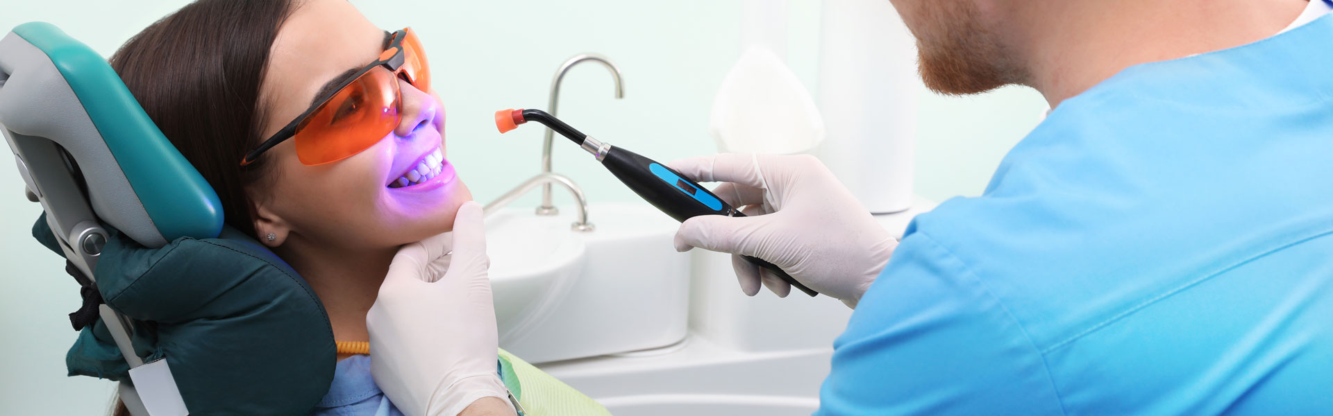 Professional dentist working with patient