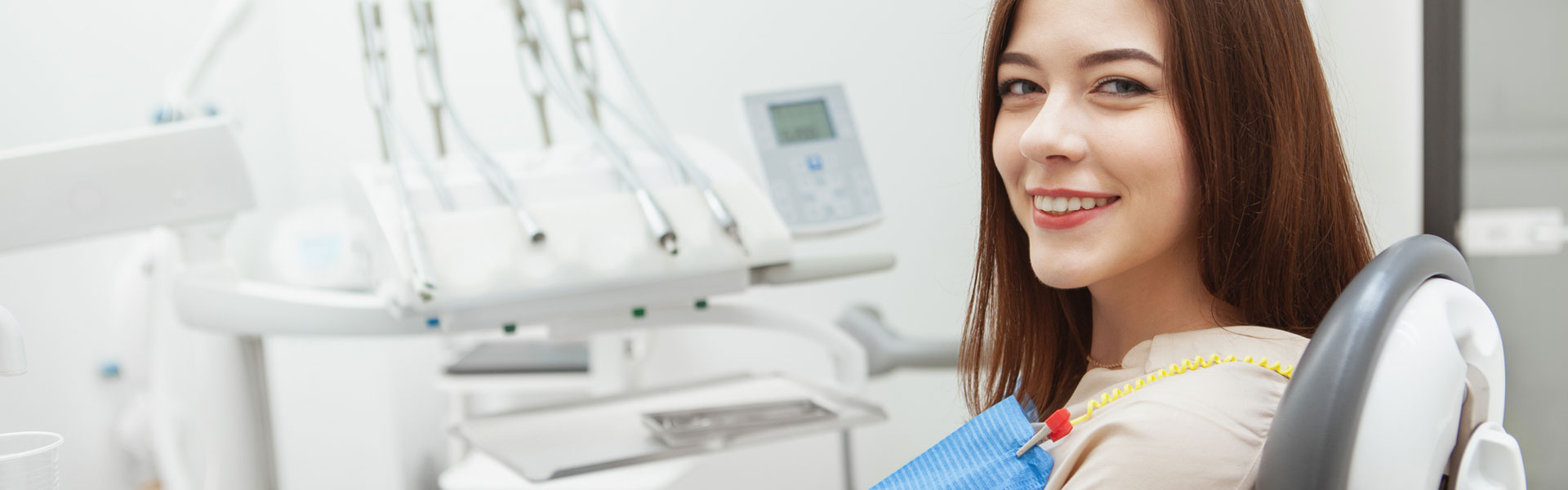 Smiling woman sitting on dental chair